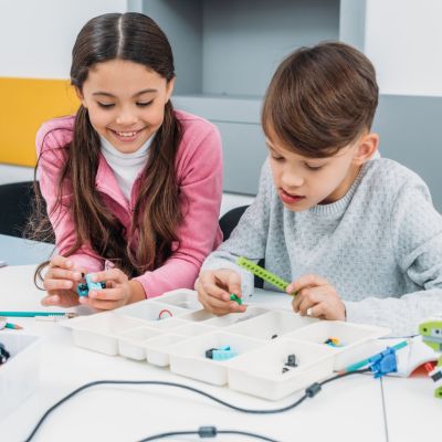 young students building small robots