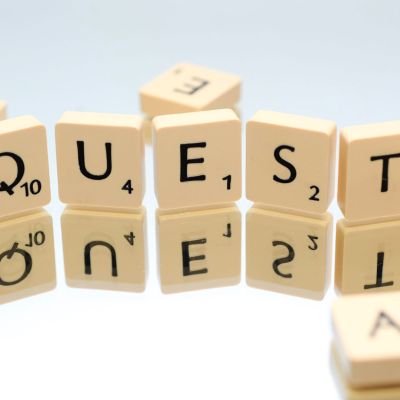 "QUEST" in scrabble tiles