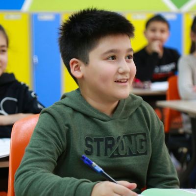 students writing in classroom