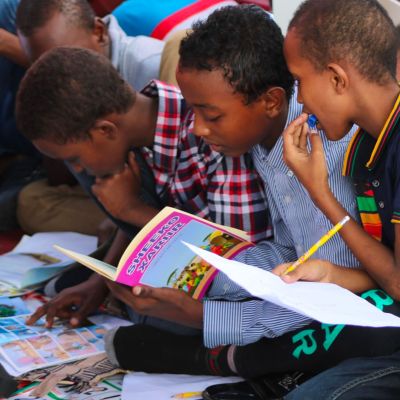 group of children working in workbooks together