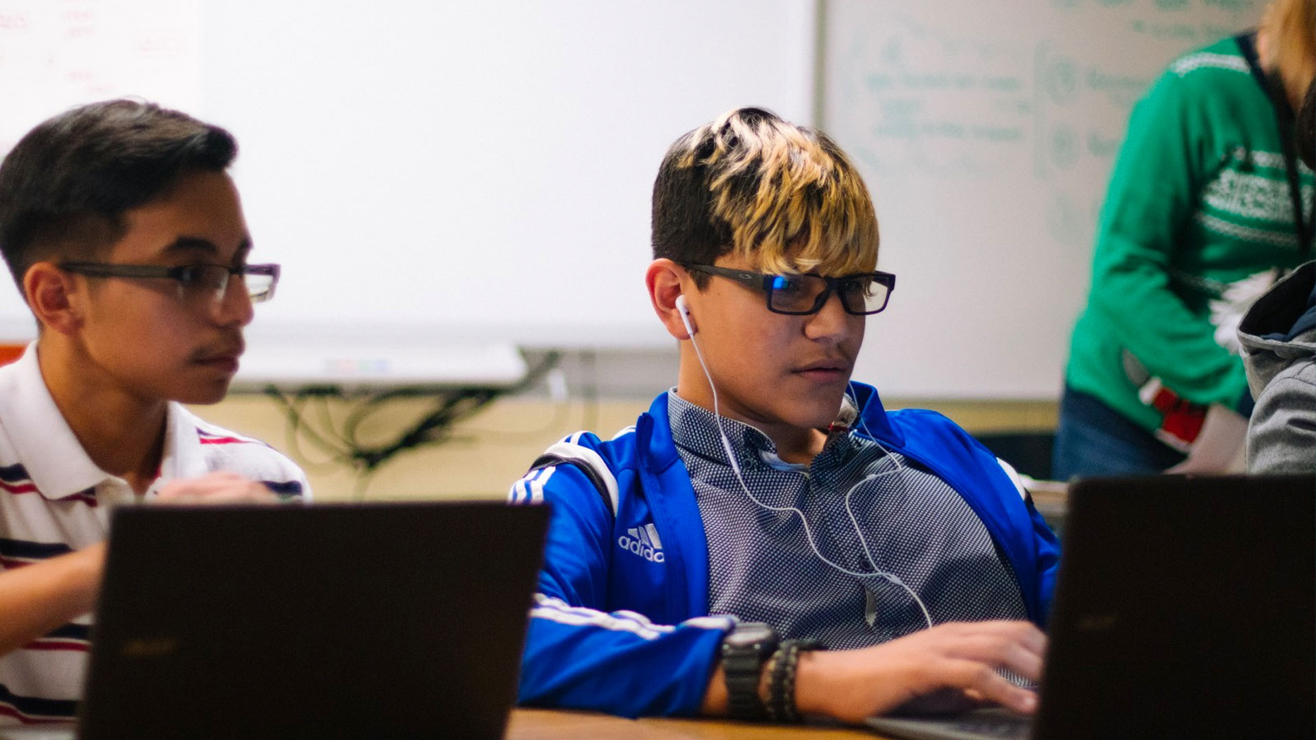 Punishment without Learning is Worthless students working on computers in a classroom