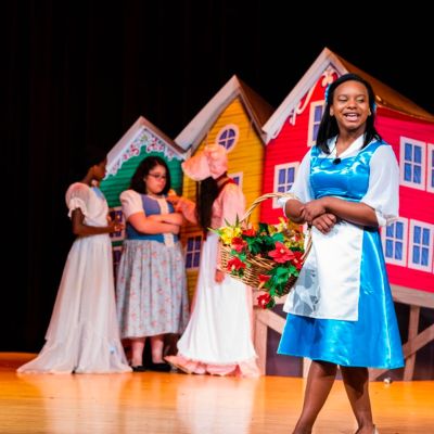 student performing as Belle