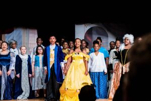 Students performing in Beauty and the Beast