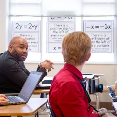 teacher talking in a classroom