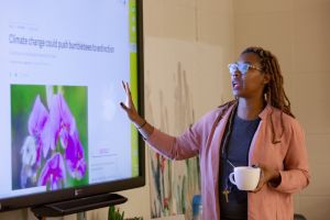 Teacher presenting at projector screen