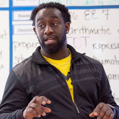 male teacher in front of a whiteboard