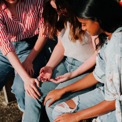 three young girls supporting eaching