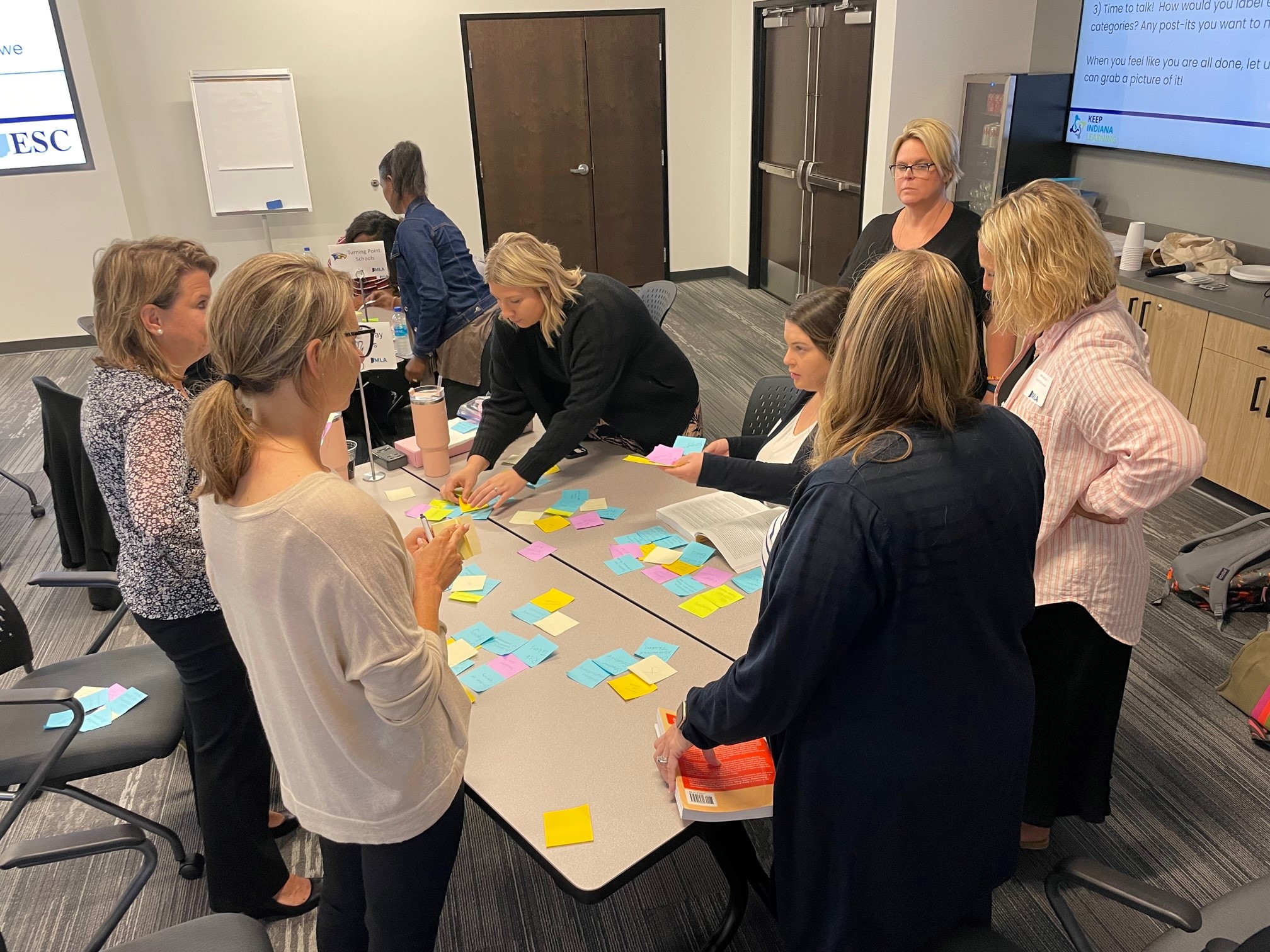 KInL - Instructional Leaders - IMLA_1 teachers working together at a conference table
