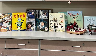books lined up on a countertop