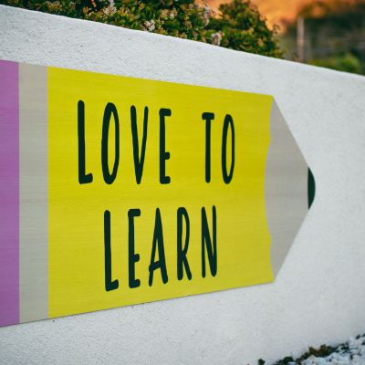 Love to Learn Sign in front of a school
