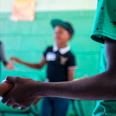 Children holding hands in a circle
