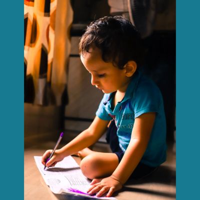 Child writing and reading.