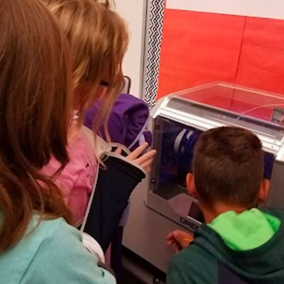 Students watching a 3D Printer
