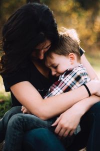 Woman holding a child.