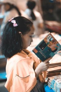Child reading a book.