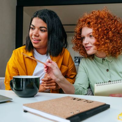 Two adults reviewing some content.