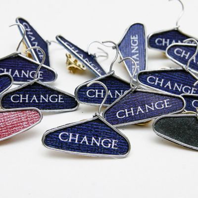 Paper clips into clothes hangers with the word "change" in the center.