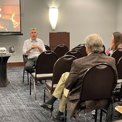 Image of people. gathered at a Conference
