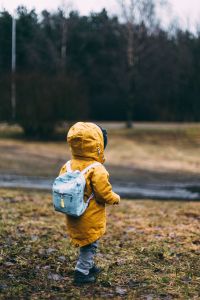 Student standing outside with a backpack on.