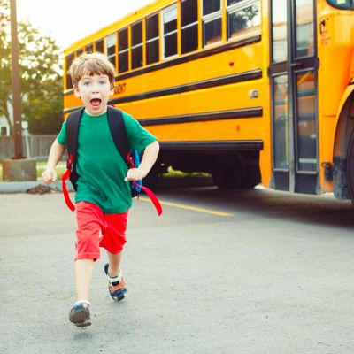 Student running off the bus.