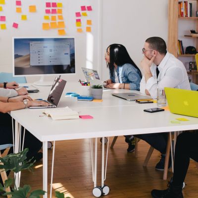 People sitting at a table, setting up a calendar.
