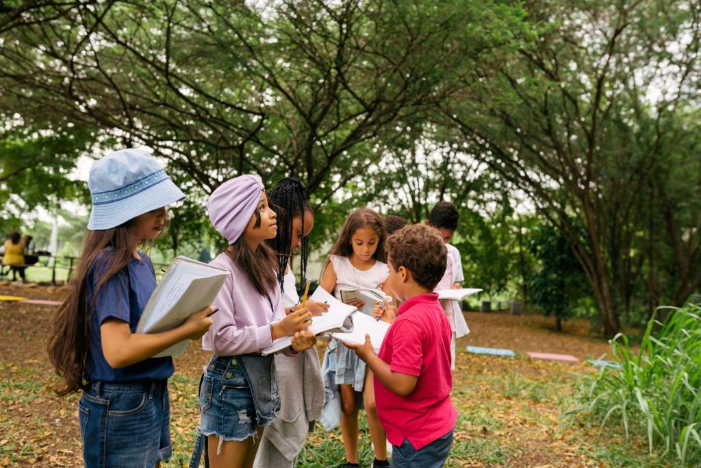 Students outside with books.