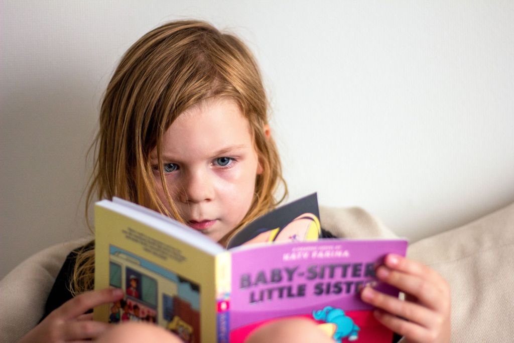 Child reading a book.