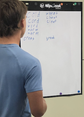Student working at the white board.