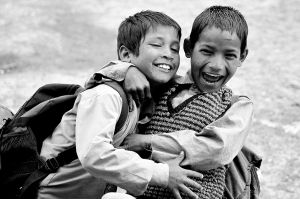 Two boys hugging.