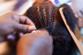 Someone getting their braids done.