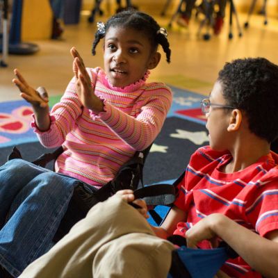 Third graders discuss possible ways to solve new math problems.