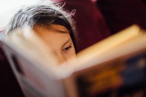 Child reading a book.