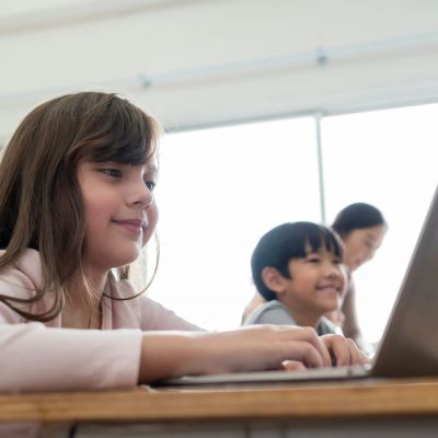 Children is a classroom using technology.