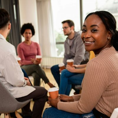 People sitting in chairs in a circle.