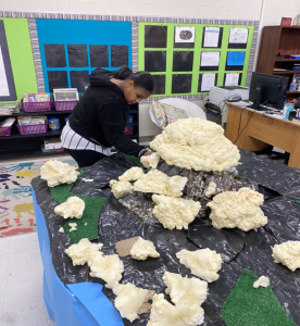 Student helping to recreate Iwo Jima.