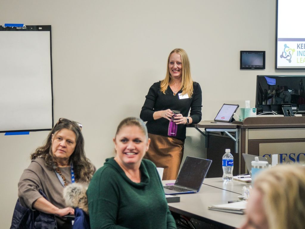 People listening to an in-person workshop.