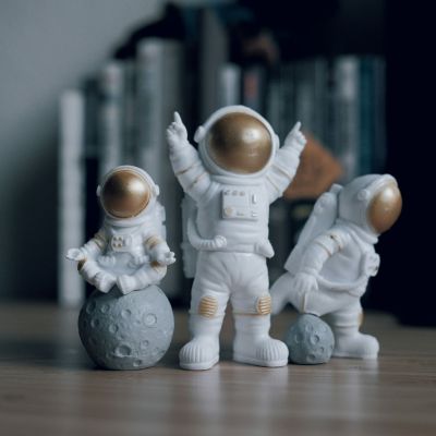 Three astronaut figurines.
