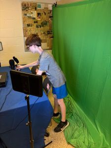 Student setting up recording area.