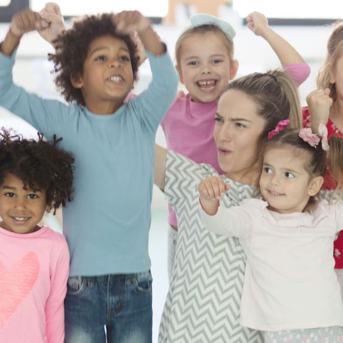 Children happy and doing victory poses.